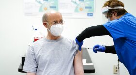Gov. Tom Wolf receives his first dose of the Moderna COVID-19 vaccine from Dr. Asceline Go at the Family First Health Center in York, Pa., Monday, April 19, 2021. (AP Photo/Matt Rourke)
