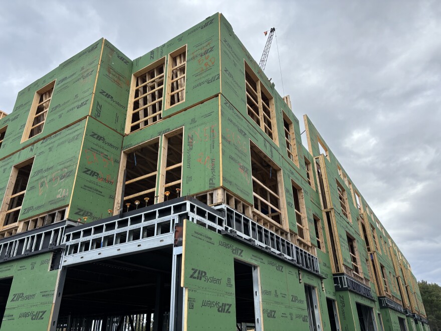 Housing under construction, missing windows and doors and siding