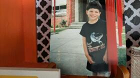 A photo of the back-to-school tableau my mom has on display at her home, featuring a portrait of me on my first day in kindergarten at Putnam Elementary School in Marietta, Ohio in 1997.