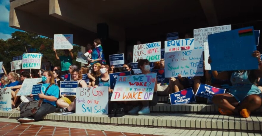 Students with signs protesting 