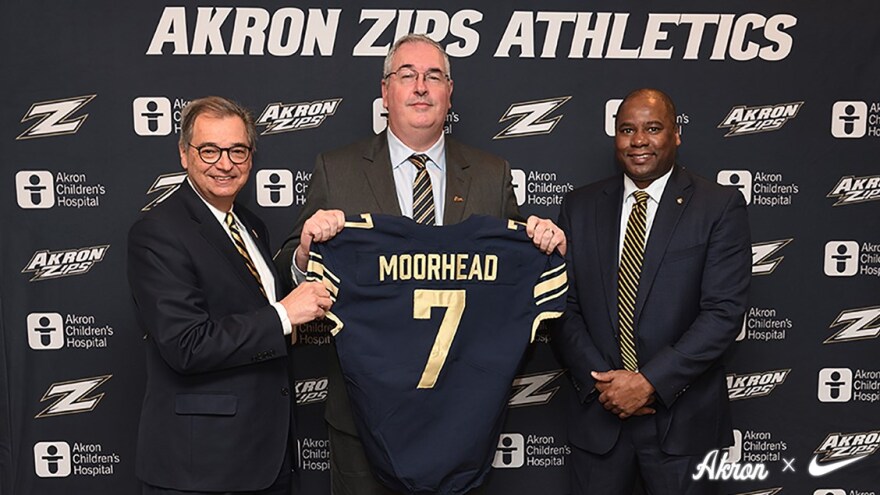  Joe Moorhead (center), introduced today by University of Akron Director of Athletics Charles Guthrie (right) and President Gary L. Miller (left).  [University of Akron /  GoZips.com]