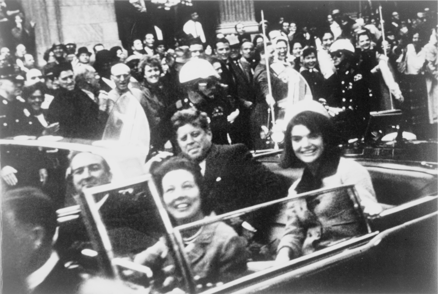 President John F. Kennedy in the presidential motorcade just before his assassination.