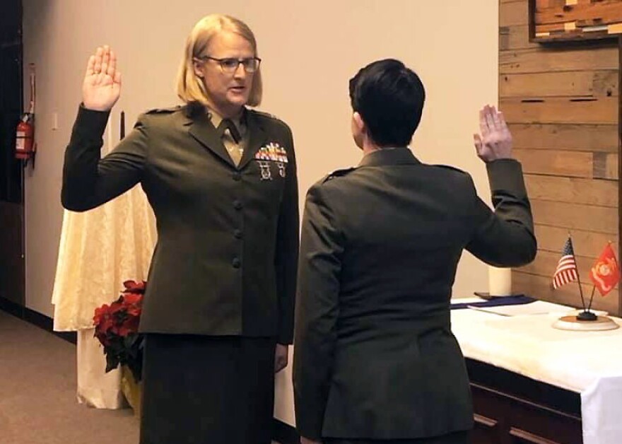 Marine judge advocate Emma Shinn (left) takes her oath of office from Maj. Rebecca Harvey in 2019.