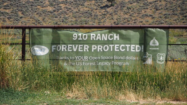 A sign celebrates Summit County's acquisition of the 8,800-acre 910 Ranch, seen here on Aug. 5, 2026.
