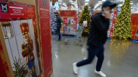 People shop among holiday displays at a Sam's Club, Wednesday, Sept. 24, 2025, in Bentonville, Ark.