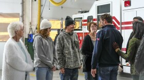 Vice President-elect JD Vance, second right, and his wife Usha Vance, right, meet with the family of battalion chief Tony Ray Garrison, who died while assisting in the rescue of victims of a landslide caused by Hurricane Helene, on a tour to survey damage caused by the hurricane, at the Fairview Volunteer Fire Department, Friday, Dec. 6, 2024 in Fairview, N.C. (AP Photo/Kathy Kmonicek)