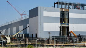 A large warehouse looking building under construction.