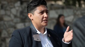 Person in suit talking