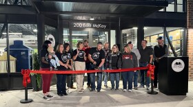 Frontenac Public Library Director Seth Nutt cuts the ribbon at the library's opening on Nov. 11.