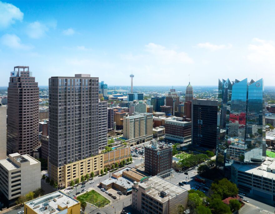 The residential high rise known as 300 Main, pictured to the left with tan lower floors, is set to open in 2024.