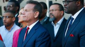 Suspended Broward County Sheriff Scott Israel, center, listens to comments by his attorney at a news conference after new Florida Gov. Ron DeSantis suspended Israel, Friday, Jan. 11, 2019, in Fort Lauderdale, Fla., over his handling of the massacre.