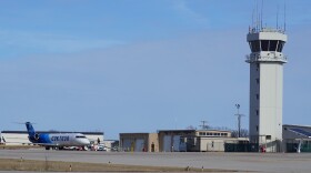 A Contour Airlines plane headed to Chicago loads passengers at the Waynesville-Saint Robert Regional Airport in front of its current terminal space. A new building will open this summer.