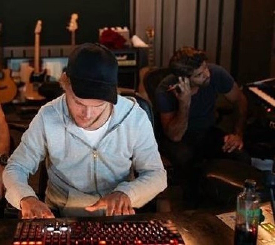 Swedish DJ Avicii, in the studio with producer Carl Falk at right.