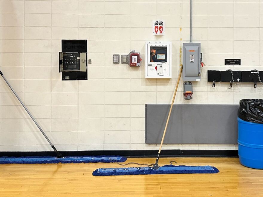 An AED mounted on the wall at Jefferson High School's gym.