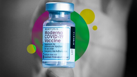 The Moderna COVID-19 Vaccine in someones hands.