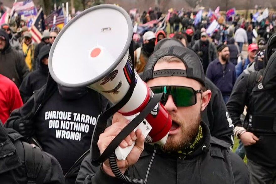 FILE - Proud Boy member Ethan Nordean walks toward the U.S. Capitol in Washington, in support of President Donald Trump on Jan. 6, 2021.