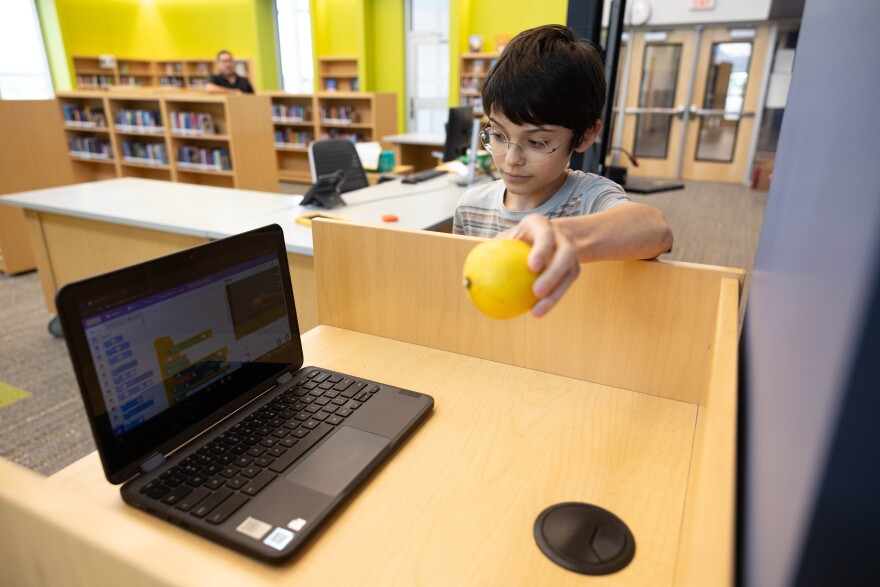 Cyril Summerfield, Middle School student at Marshall Middle School showing his prototype, a waste detector to help combat human error in sorting waste by using technology to assist students and staff on campus to help custodians from having to dig into contaminated recycle and compost bins and help save the planet on April 25, 2024.