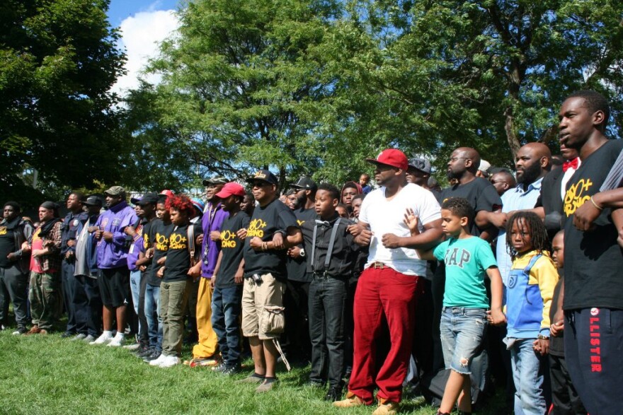 Black men and boys lock arms at a rally in Milwaukee’s Sherman Park neighborhood on Sept. 10, 2016. The rally was organized by the 300+ Strong coalition, which includes Black-led organizations serving Milwaukee youth. The coalition was created in conjunction with the national My Brother’s Keeper initiative and the Milwaukee Black Male Achievement Advisory Council.
