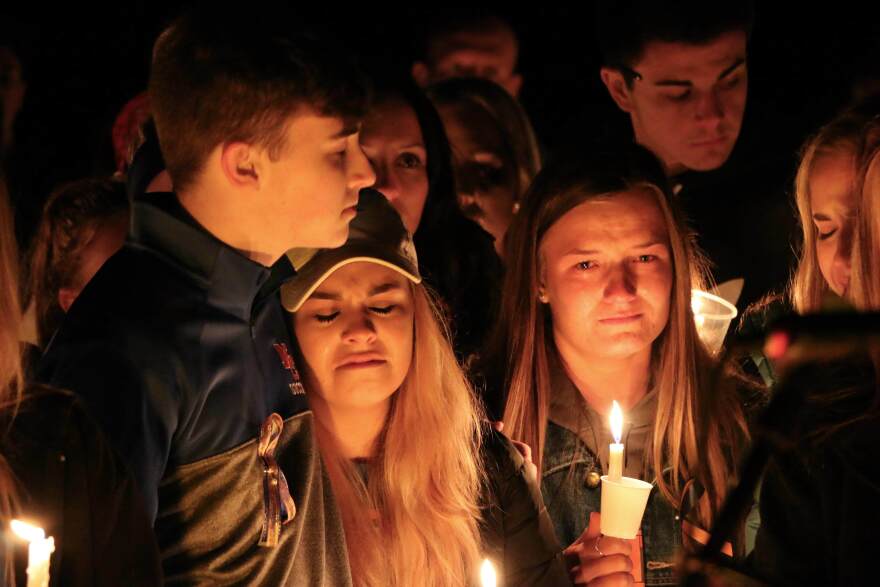 Mourners attend a vigil for the victims of a fatal shooting at Marshall County High School on Thursday, Jan. 25, 2018, at Mike Miller County Park in Benton, Ky. 