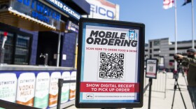 A mobile ordering sign is seen on March 30 at a vending station in Nationals Park, home of the Washington Nationals. The Nats, along with many other teams in baseball, are implementing new safety protocols, including for ordering food, as a new season kicks off on Thursday.