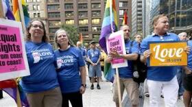 Supporters of gay marriage in Wisconsin and Indiana attend a rally at the federal plaza Monday, Aug. 25, 2014, in Chicago. The Chicago-based 7th U.S. Circuit Court of Appeals will hear arguments Tuesday on gay marriage fights from Indiana and Wisconsin, setting the stage for one ruling. Each case deals with whether statewide gay marriage bans violate the Constitution. (AP Photo/Charles Rex Arbogast)