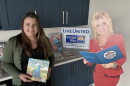 Angela Bassani, President & CEO of United Way of Lackawanna, Wayne & Pike, holds one of the first books children receive from Dolly Parton's Imagination Library. The United Way runs the local chapter of the library program.