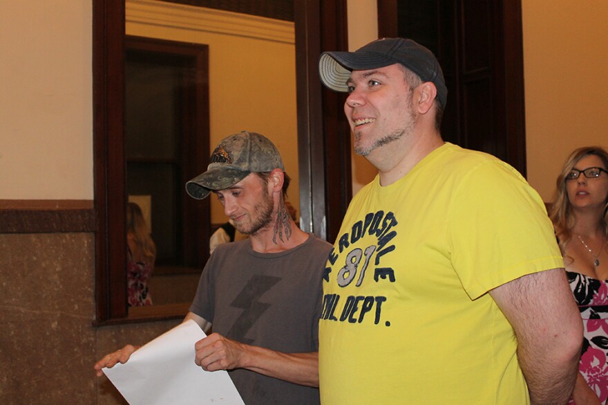 Richard Hooper, left, and Raymond Lindsey of Hayti, Mo. wait in line to check in for the wedding ceremony on Saturday, June 27, 2015 during Pride St. Louis.