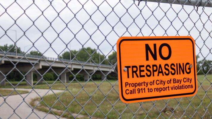 An area near Bay City's Liberty Bridge is contaminated with high levels of toxic metals. Officials are trying to rehome more than 10 people who were staying on the city proeprty.