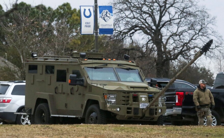 An armored law enforcement vehicle is seen in the area where a man has reportedly taken people hostage at a synagogue during services that were being streamed live, in Colleyville, Texas, U.S. January 15, 2022. REUTERS/Shelby Tauber