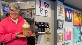 Luzann Torres holds a Bad Bunny-inspired latte at her coffee shop Aroma Café in West Allis. The Puerto Rican artist will perform on Feb. 8 during the 2026 Super Bowl halftime show.