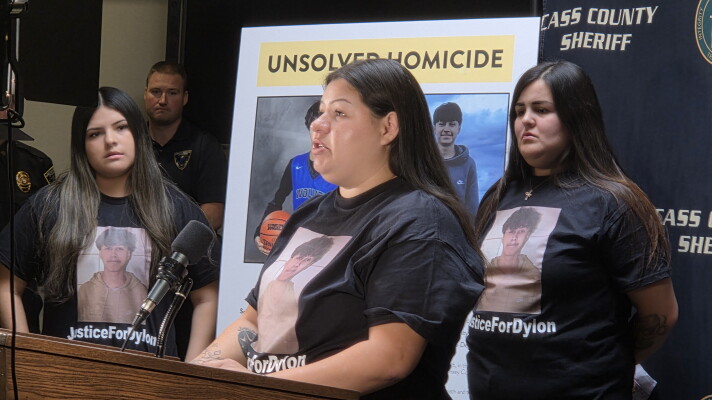 Monica Oothoudt, 27, pleads for answers about the death of her cousin, 17-year-old Dylon Oothoudt, at a press conference in Cass Lake on Oct. 7, 2026. Standing behind her are Dylon's cousin, Dalyla Oothoudt, and his sister, Rosa Oothoudt.