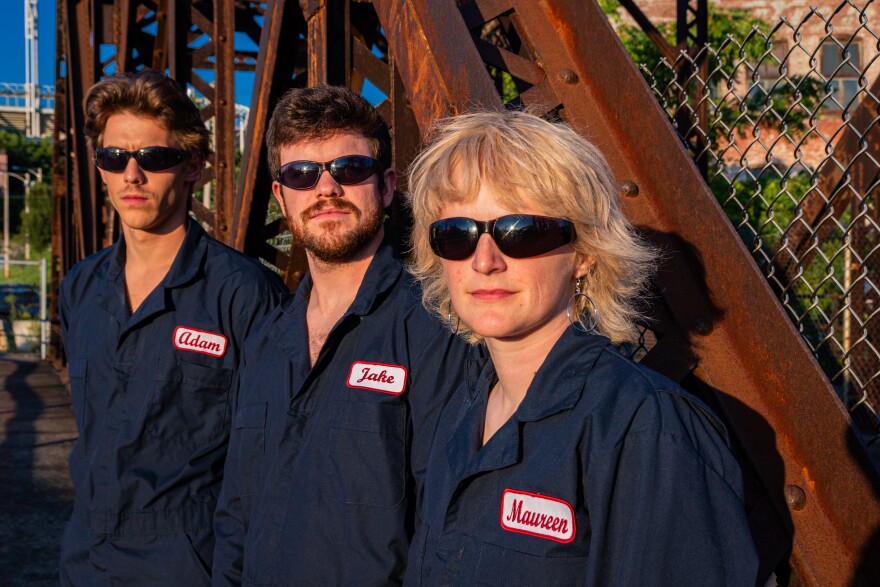 PAL's Adam Atkinson, Jake Schott and Maureen Joyce wear jumpsuits and sunglasses