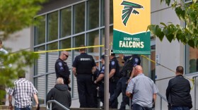 Tacoma Police officers investigate after multiple people were injured in a stabbing at Foss High School, Thursday, April 30, 2026, in Tacoma, Wash. (AP Photo/John Froschauer)
