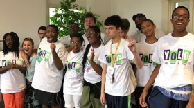 Participants in the Center for Independent Living Options' Youth Overcoming Life Obstacles program model their new shirts.