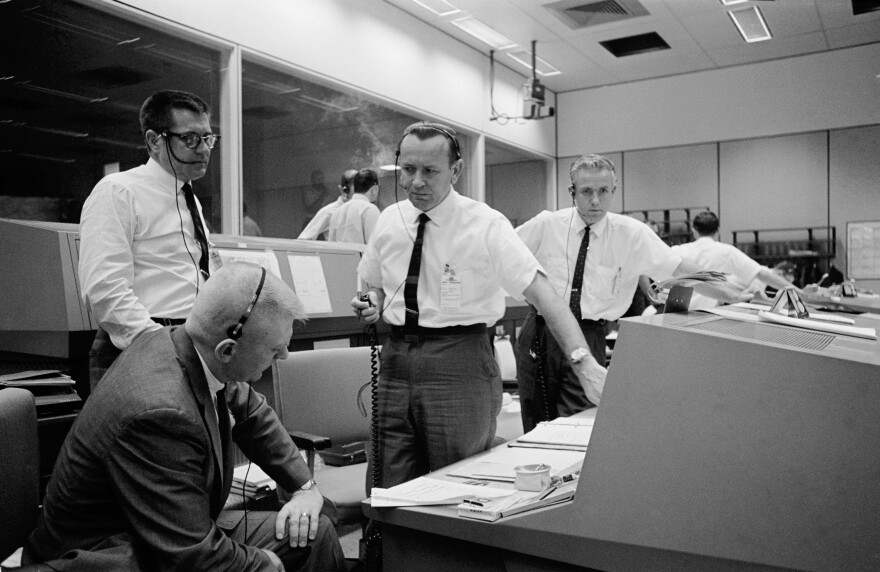 Chris Kraft (center) discussing the scrubbing of the planned Gemini 6 spaceflight in 1965.