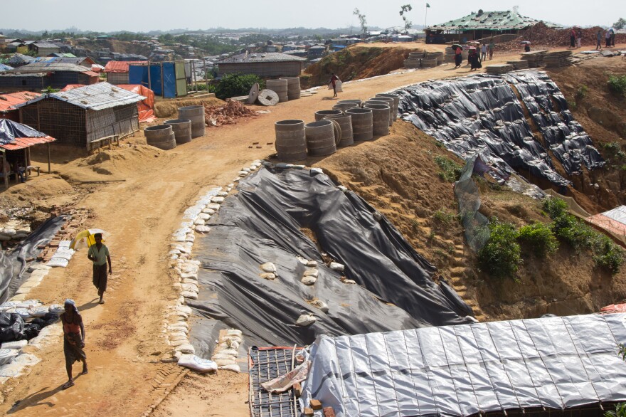 Black plastic sheeting and sandbags shore up a road through the Balukhali Rohingya refugee camp. The sandy soil is highly prone to erosion and has been washing away in the monsoon rains.