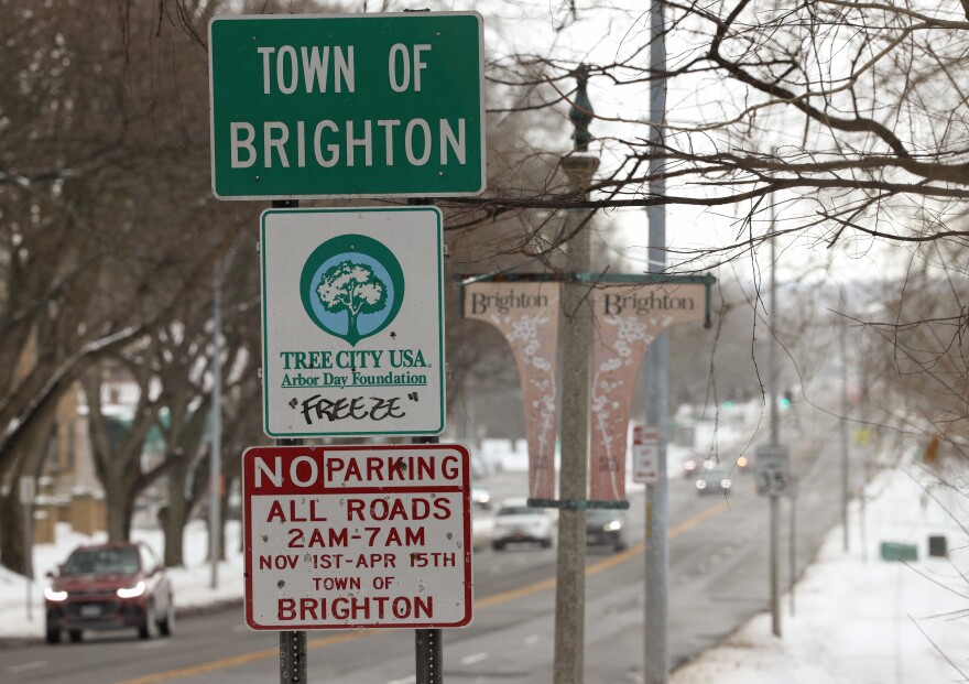 Traffic moves along Monroe Avenue in Brighton, N.Y., where the state Department of Transportation has proposed a resurfacing project that would reconfigure much of the corridor, add improved crosswalks, and potentially lower the speed limit to improve safety for drivers, pedestrians and cyclists.