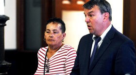 FILE: Nilsa Heredia, a canvasser for Mayor Joe Ganim, stands in Connecticut Superior Court during a hearing in Bridgeport, Conn. June 24, 2024. Heredia was arrested along with three others earlier this month on charges related to the mishandling absentee ballots during the Democratic primary for Bridgeport Mayor in 2019. She is seen here with attorney Kenneth Krayeske.
