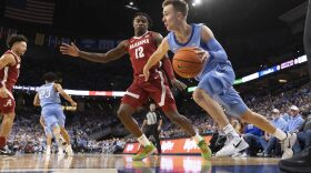 Creighton's Steven Ashworth, right, drives against Alabama's Latrell Wrightsell Jr. (12) during the second half of an NCAA college basketball game Saturday, Dec. 16, 2023, in Omaha, Neb. Creighton defeated Alabama 85-82. (AP Photo/Rebecca S. Gratz)
