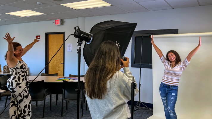 Rebeca Carrasquillo (left) is helping her mentee Esmeraida Figueroa (right) with her poses for a photoshoot with Big Brothers Big Sisters of Connecticut on September 19, 2026. The pair were photographed for a feature in the organization's 2026 Annual Report.