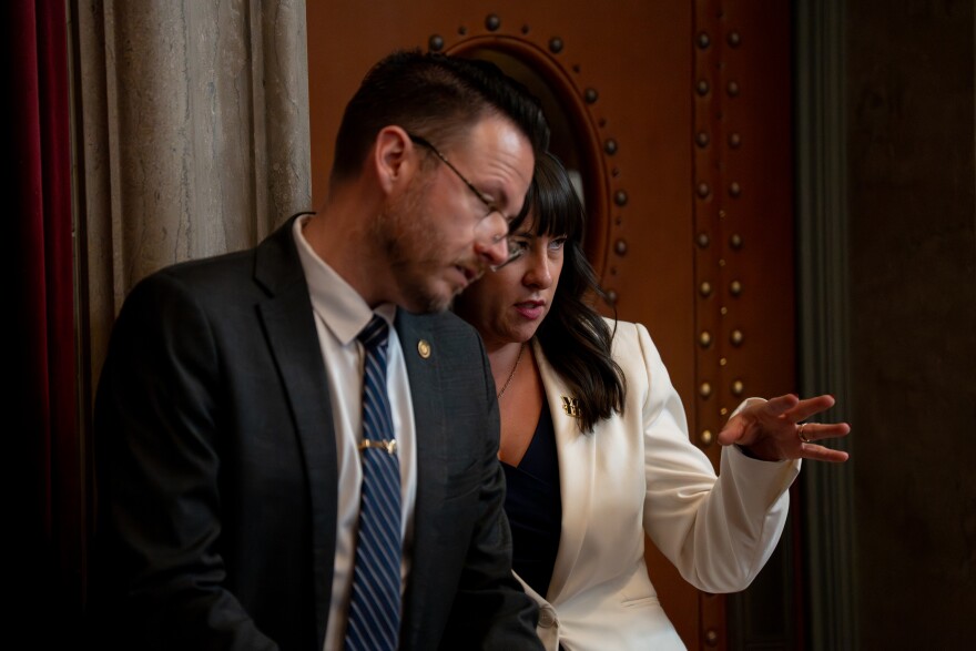 Missouri House Minority Leader Rep. Ashley Aune, D-Kansas City, right, speaks with Minority Whip Aaron Crossley, D-Independence, during an extraordinary legislative session Monday, Sept. 8, 2025, at the Capitol in Jefferson City, Mo.