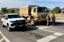 The Nevada Army National Guard blocks roads to prevent the public from re-entering evacuation zones, Sunday, Aug. 23, 2026.