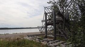 Fish wheels like this one sit unused along the along the banks of the Yukon River.