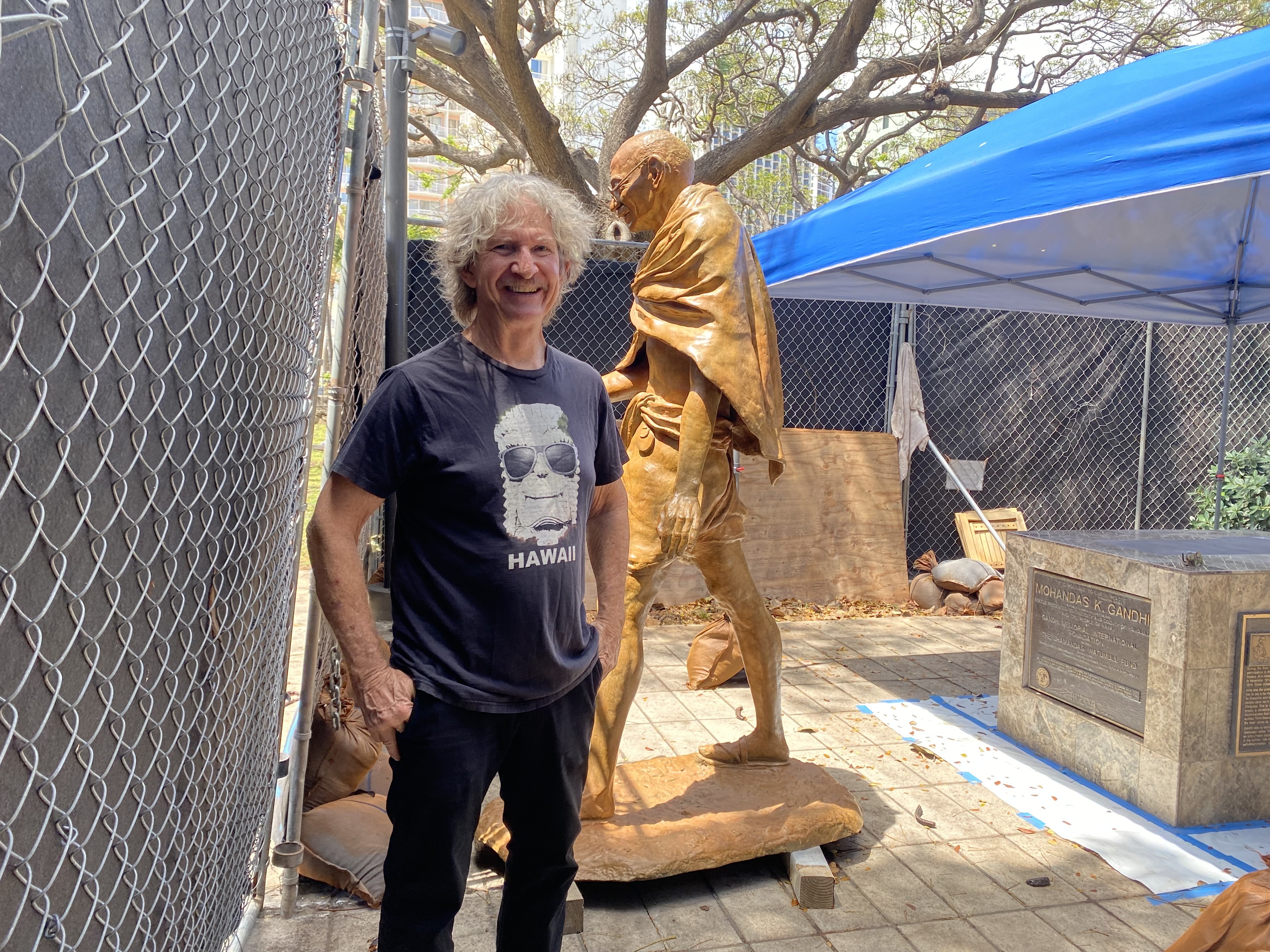 Local artist puts final touches on damaged Gandhi statue at