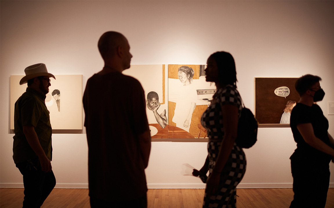 Viewers walk in front of a gallery at UNLV's Barrick Museum.