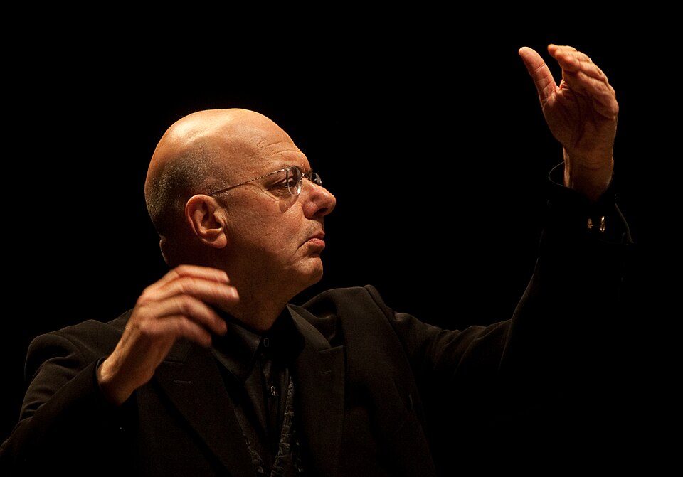 https://npr.brightspotcdn.com/fb/fc/f808421140fe86e5f6ee1c623dd1/leon-botstein-conducting-cropped.jpg