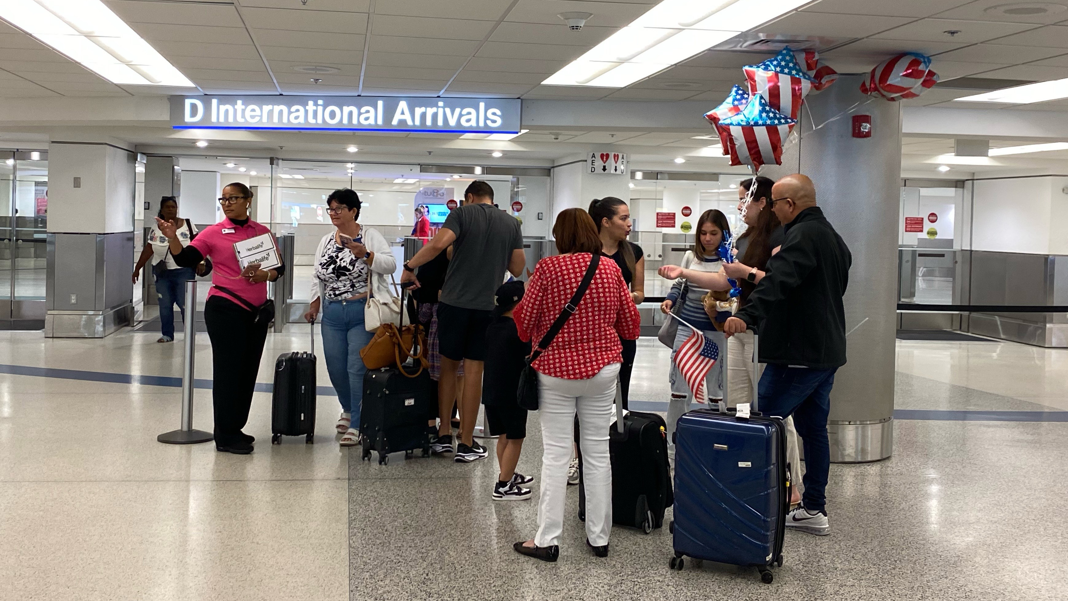 Foreign visitors arrive at Miami International Airport — just before start  of Trump's travel ban | WLRN