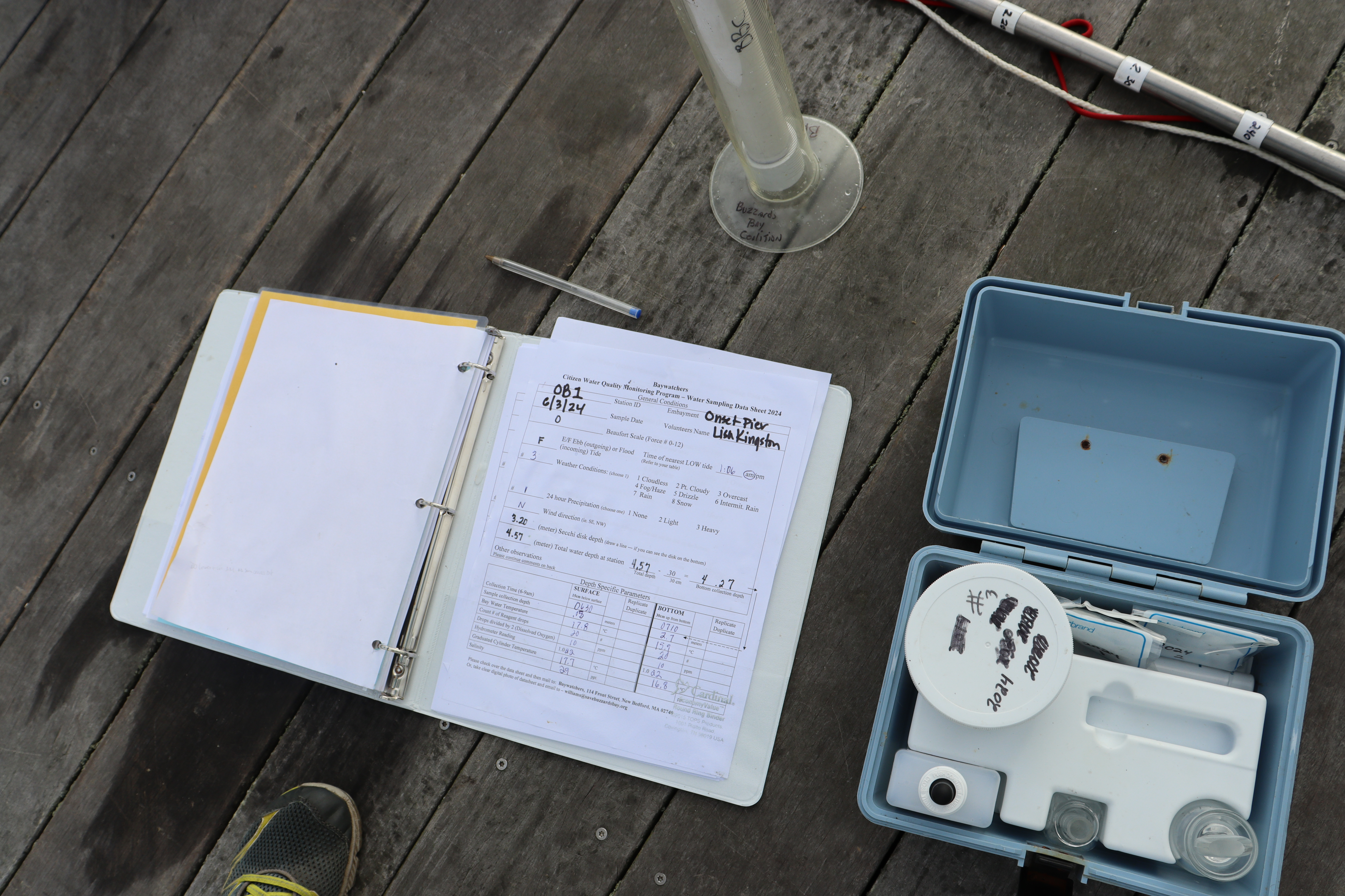 Susan Scott and Lisa Kingston fill out a data sheet every time they collect water samples in Buzzards Bay.