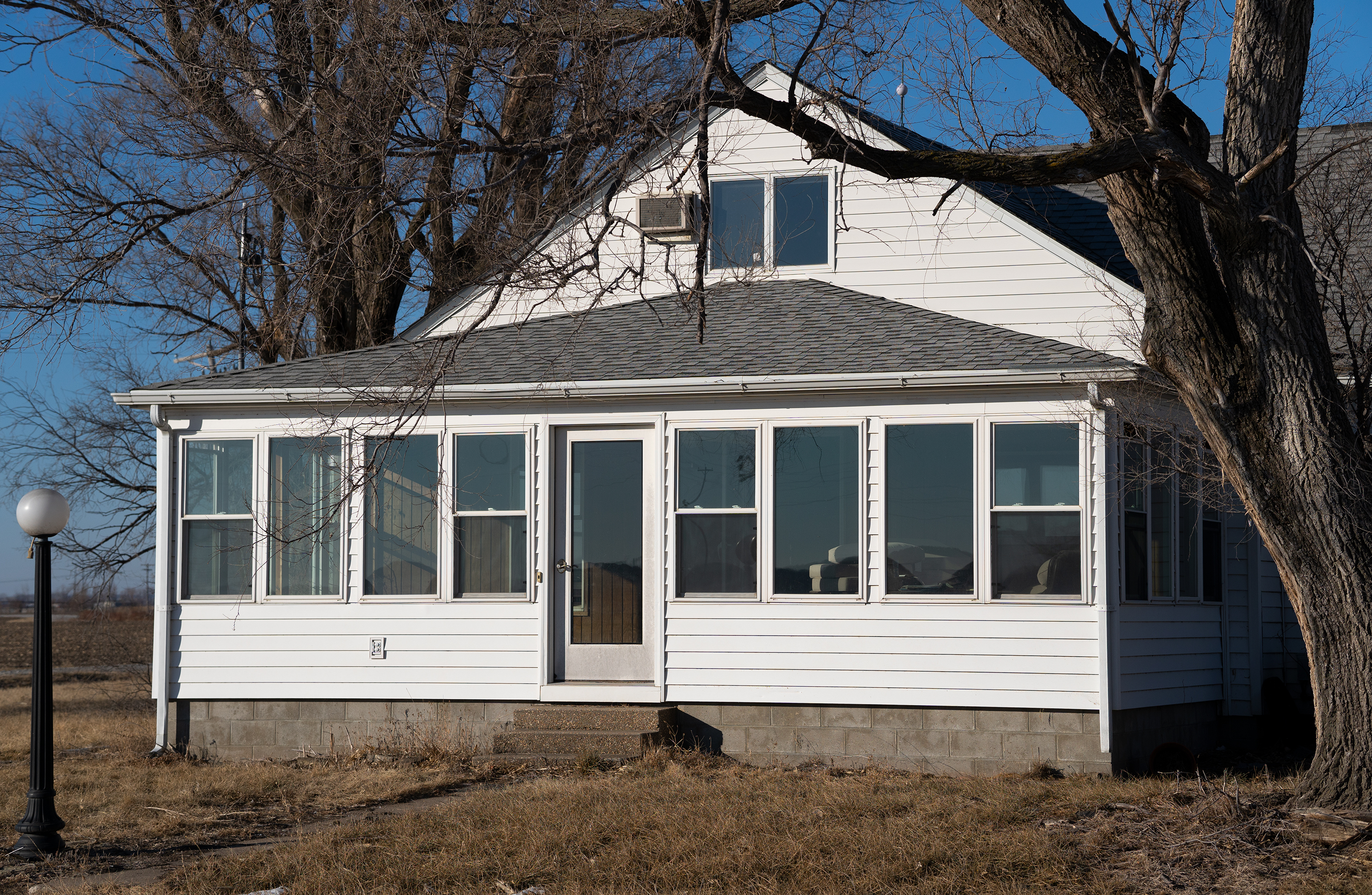 Floodwaters swamped Richard Oswald's farm and childhood home, shown here, in 2019. He also lost about 26,000 bushels of corn in the flood.