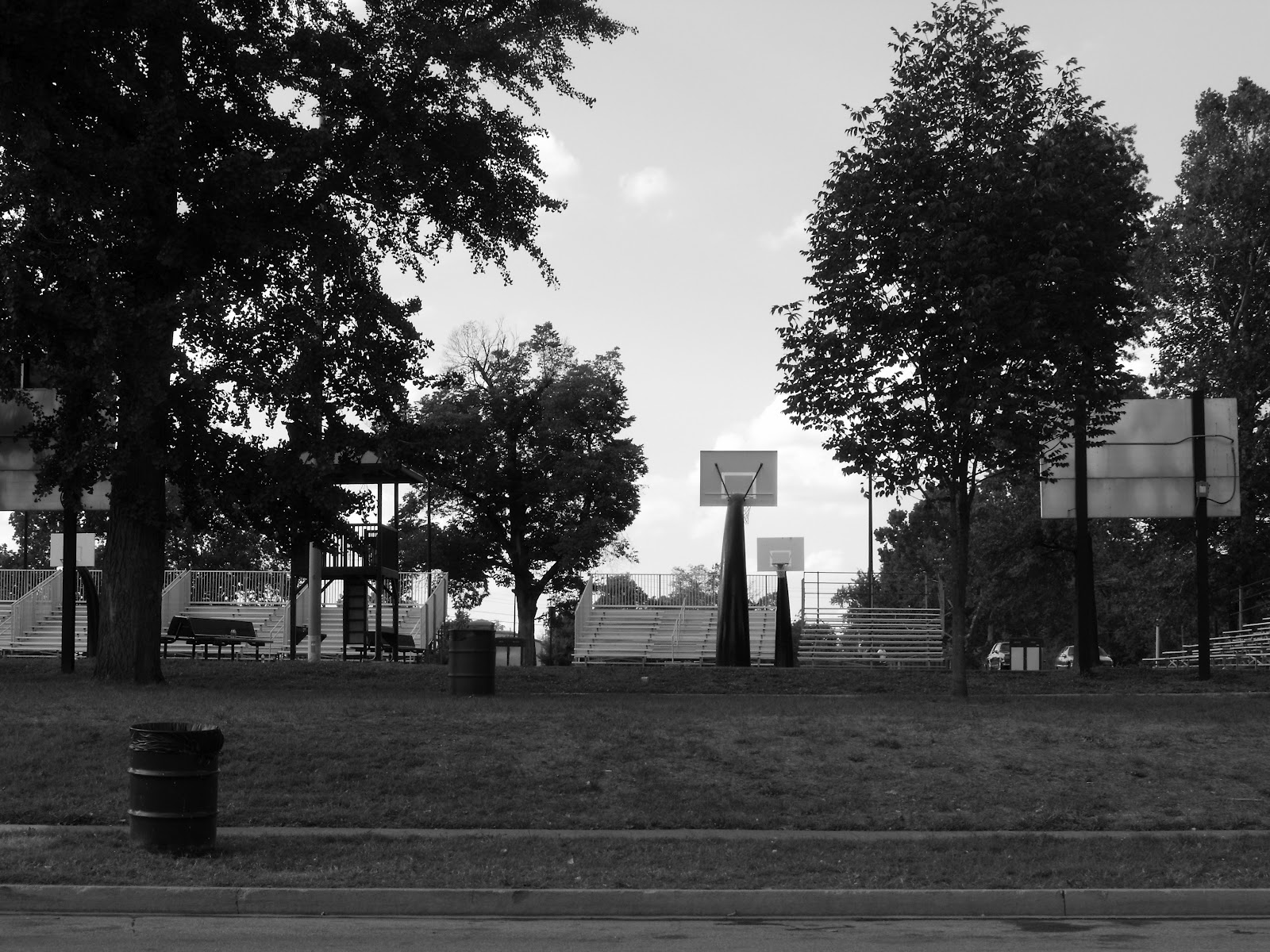 Basketball courts, trees, and bleachers at Douglass Park in Lexington